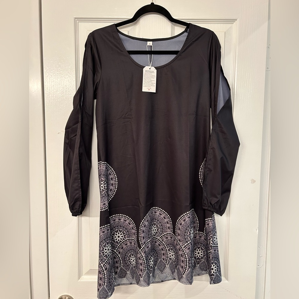 Simple black dress with open slots along sleeves. A-line cut. Small.